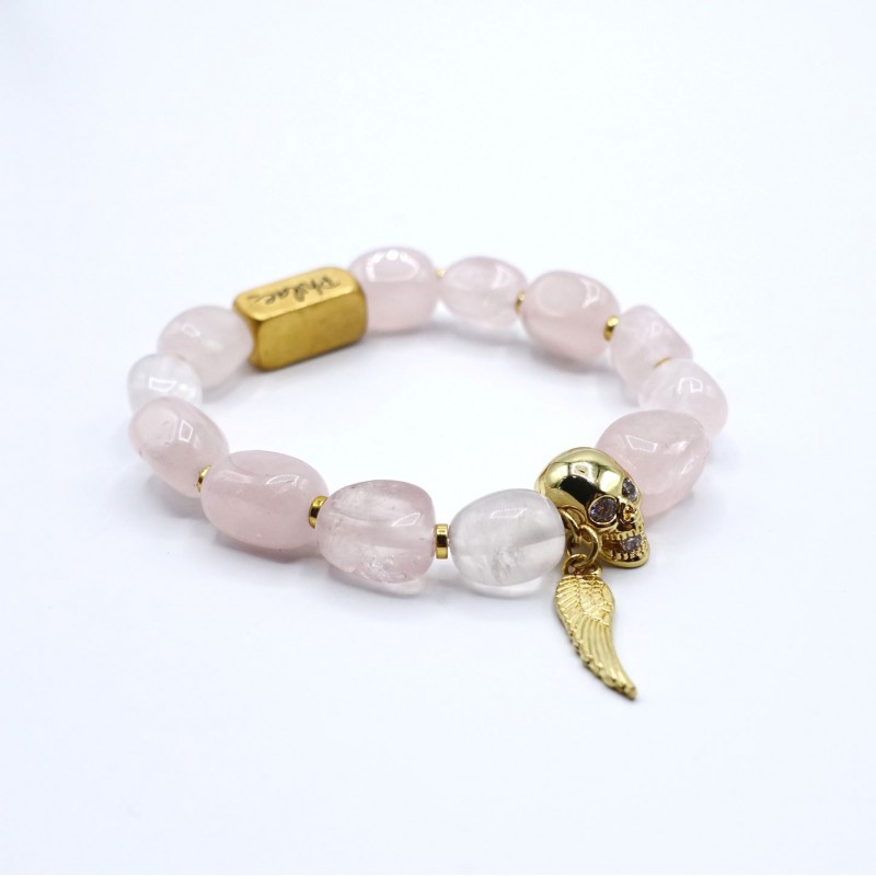Bracelet en quartz rose avec tête de mort et plume dorée