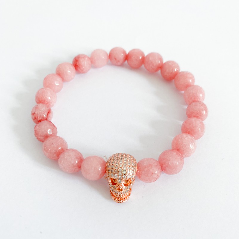 Bracelet rose en agate avec tête de mort à strass dorée